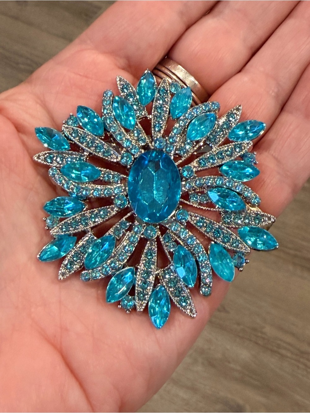 Sparkling Blue Crystal Floral starburst silver tone Brooch